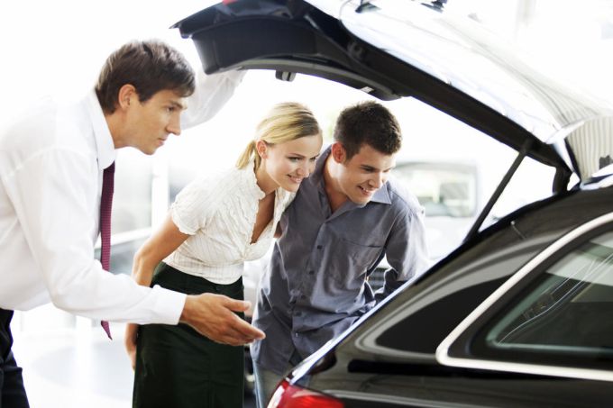 a_young_couple_admiring_a_new_car_low.jpeg
