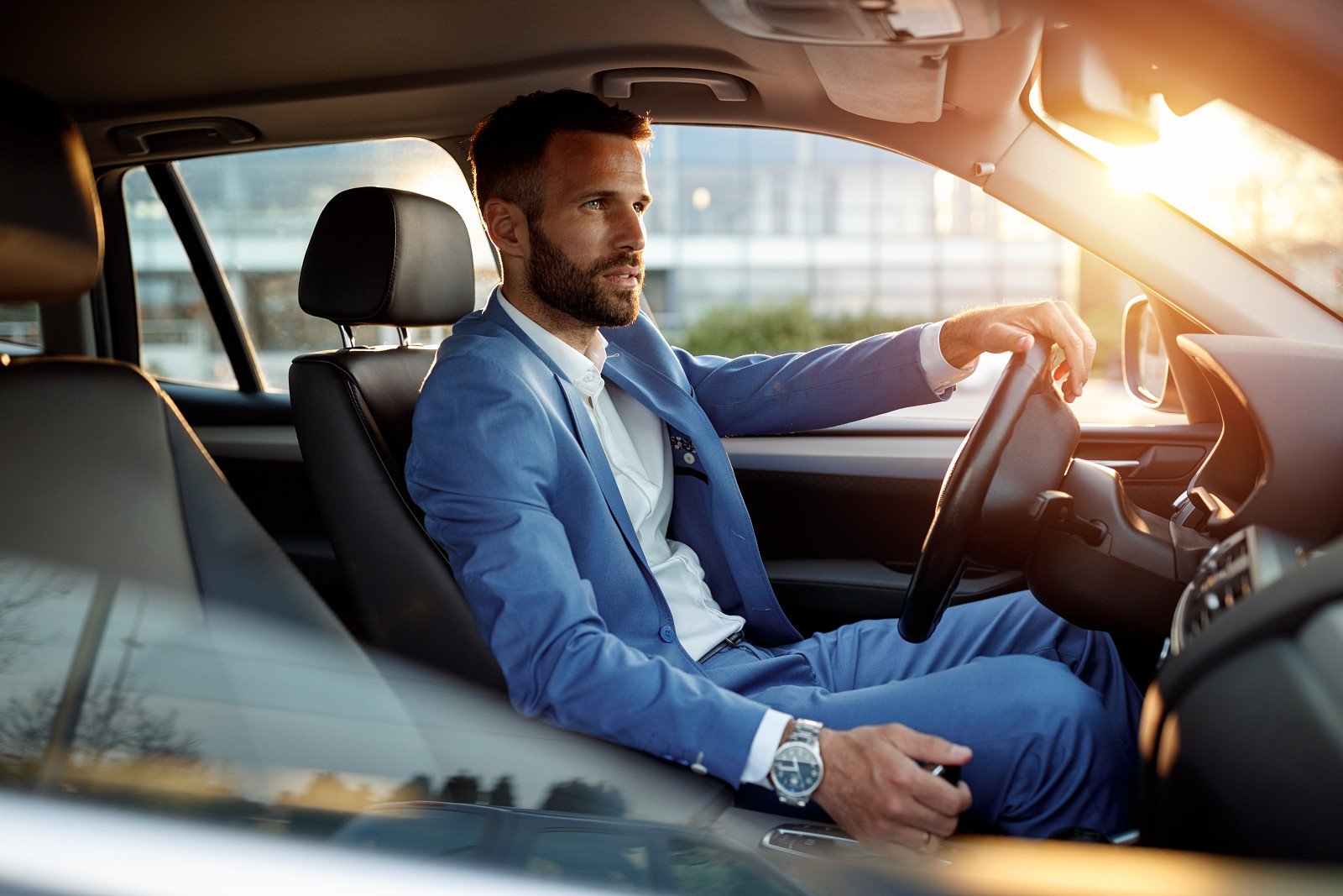 attractive_man_driving_his_car_high.jpg